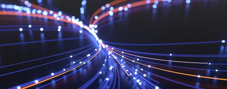Die computergenerierte Illustration zeigt zusammenlaufende blaue und rote Linien mit hellen Punkten.